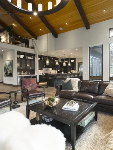 Interior Makeovers Collections 4 Large living room with brown leather couches and chairs. Designed by Interior Makeovers.