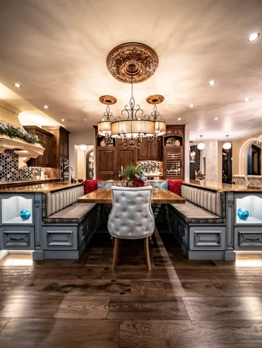 Interior Makeovers Collections 2 Side view of a long, wooden dining table with booth seating on either side in Colorado.